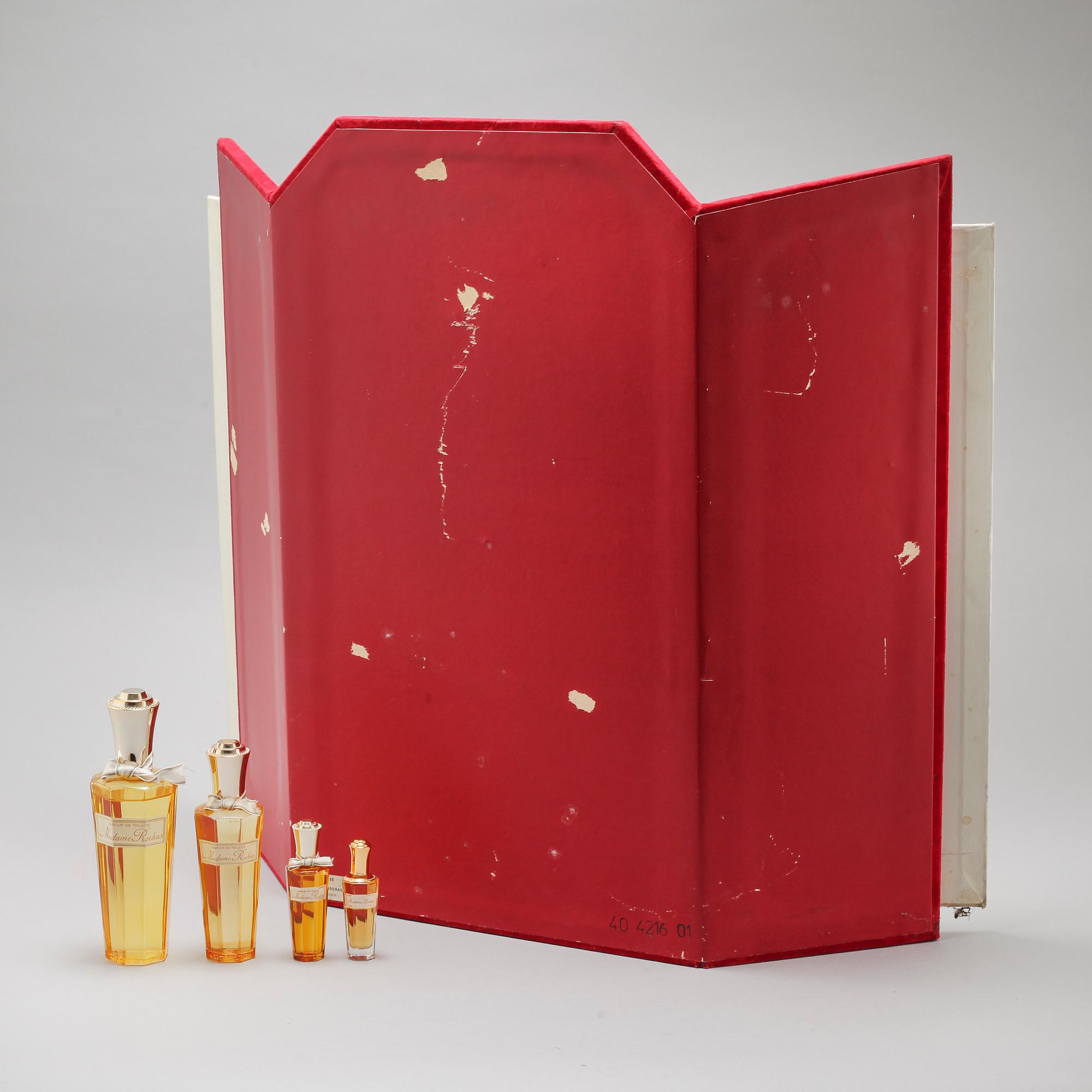 A shop display and four so called factices, Madame Rochas.