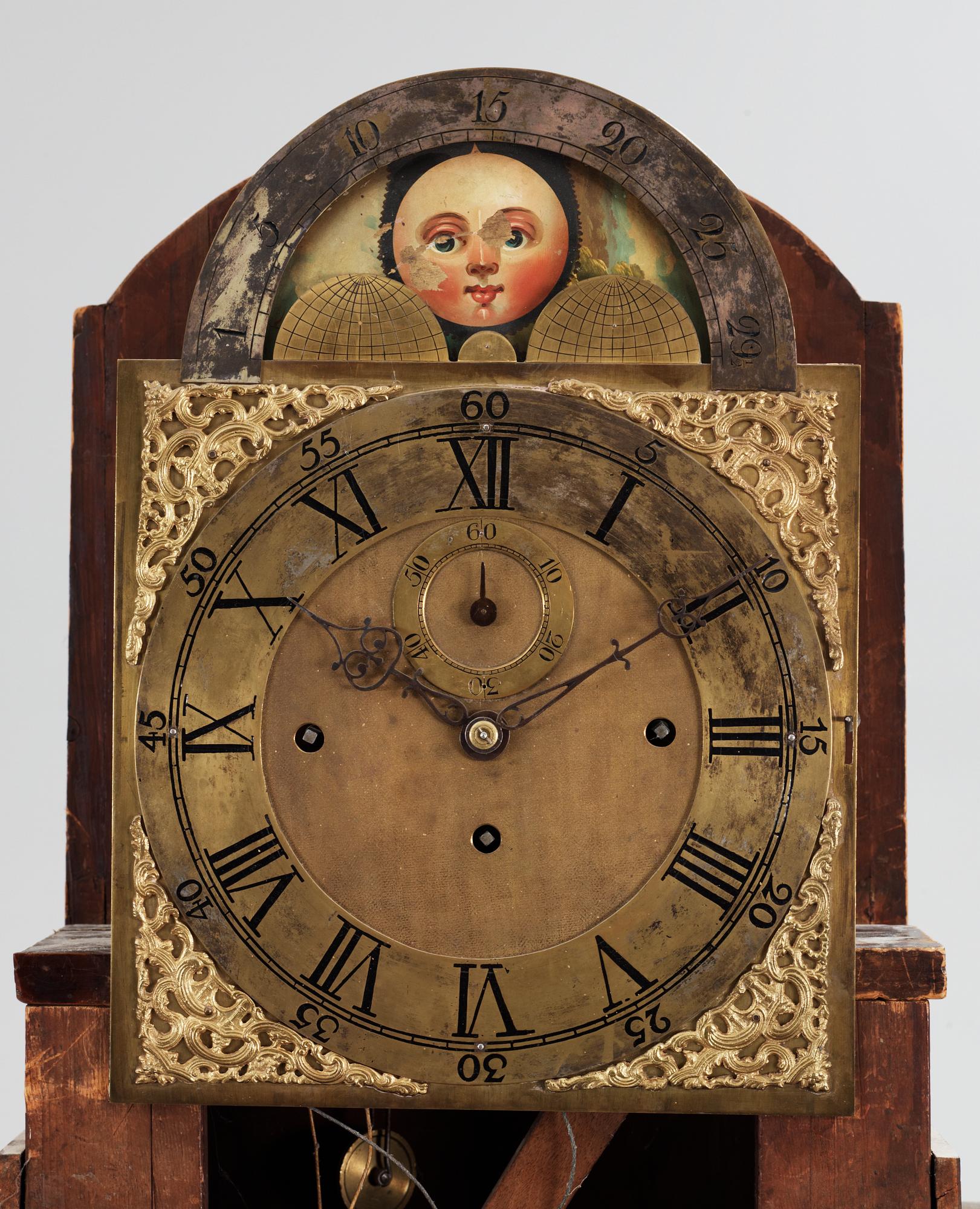An English circa 1800 mahogany veneer longcase clock.