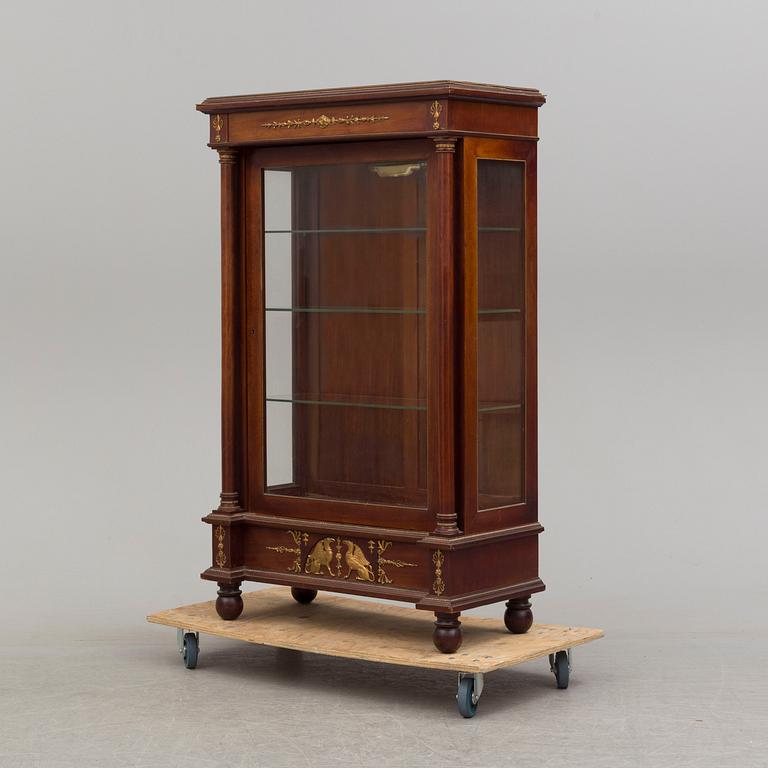 A mahogany veneered Empire style cabinet, circa 1900.