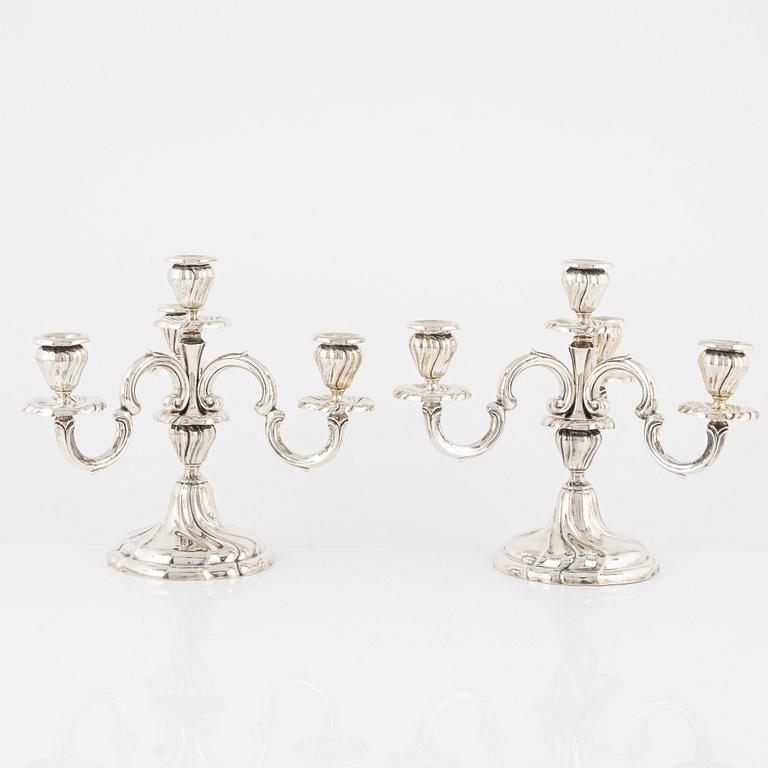 A pair of silver Rococo-style candelabra, Germany, first half of the 20th century.