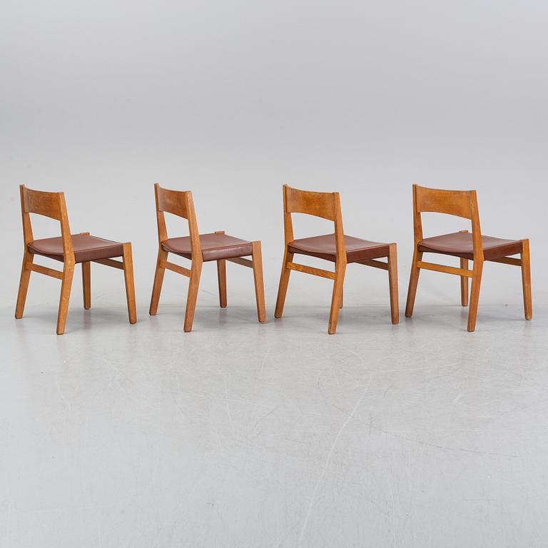 Four oak chairs with leather seat by John Vedel Rieper, Denmark, 1962.