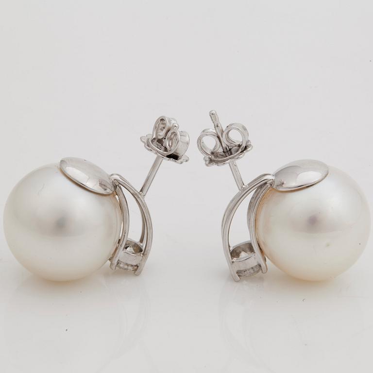 A pair of cultured South sea pearl and brilliant cut diamond earrings.