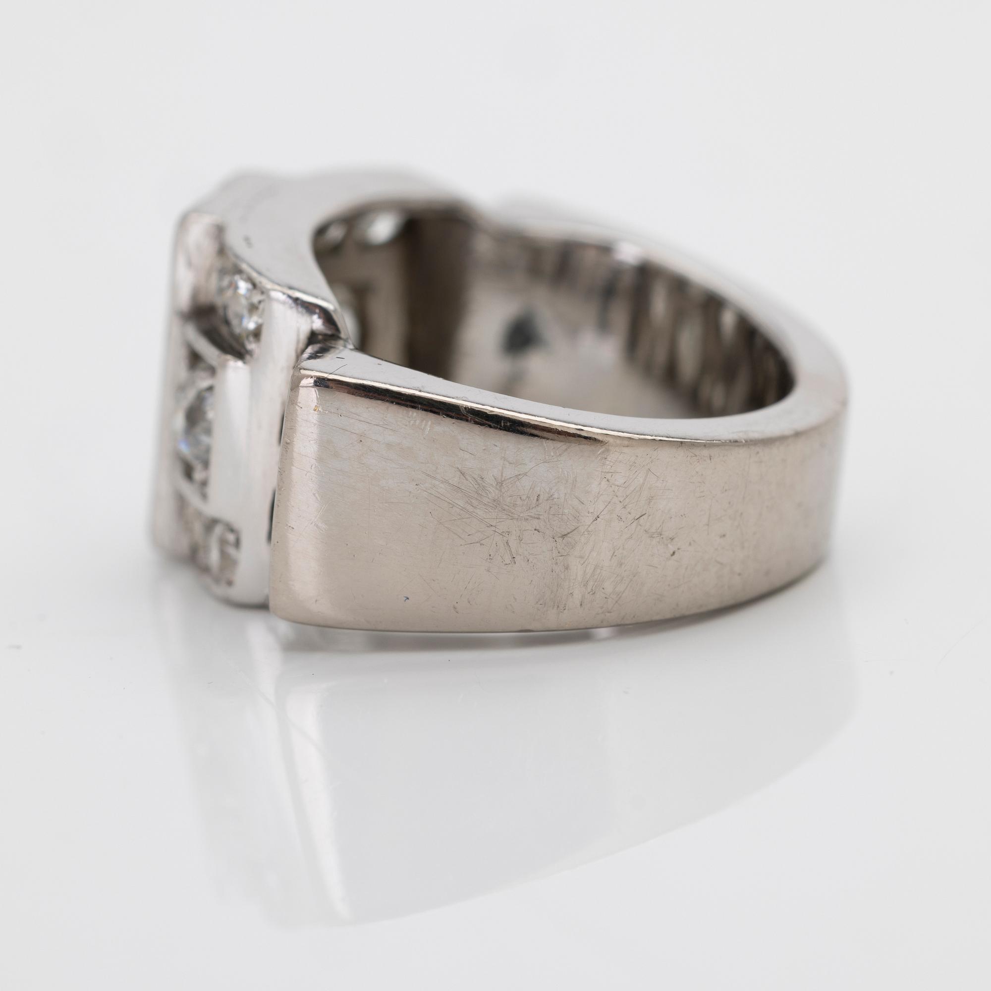 18K white gold ring with diamonds.