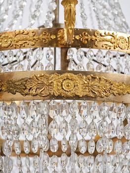 An ormolu and cut glass sixteen-branch Empire chandelier, Paris, early 19th century.