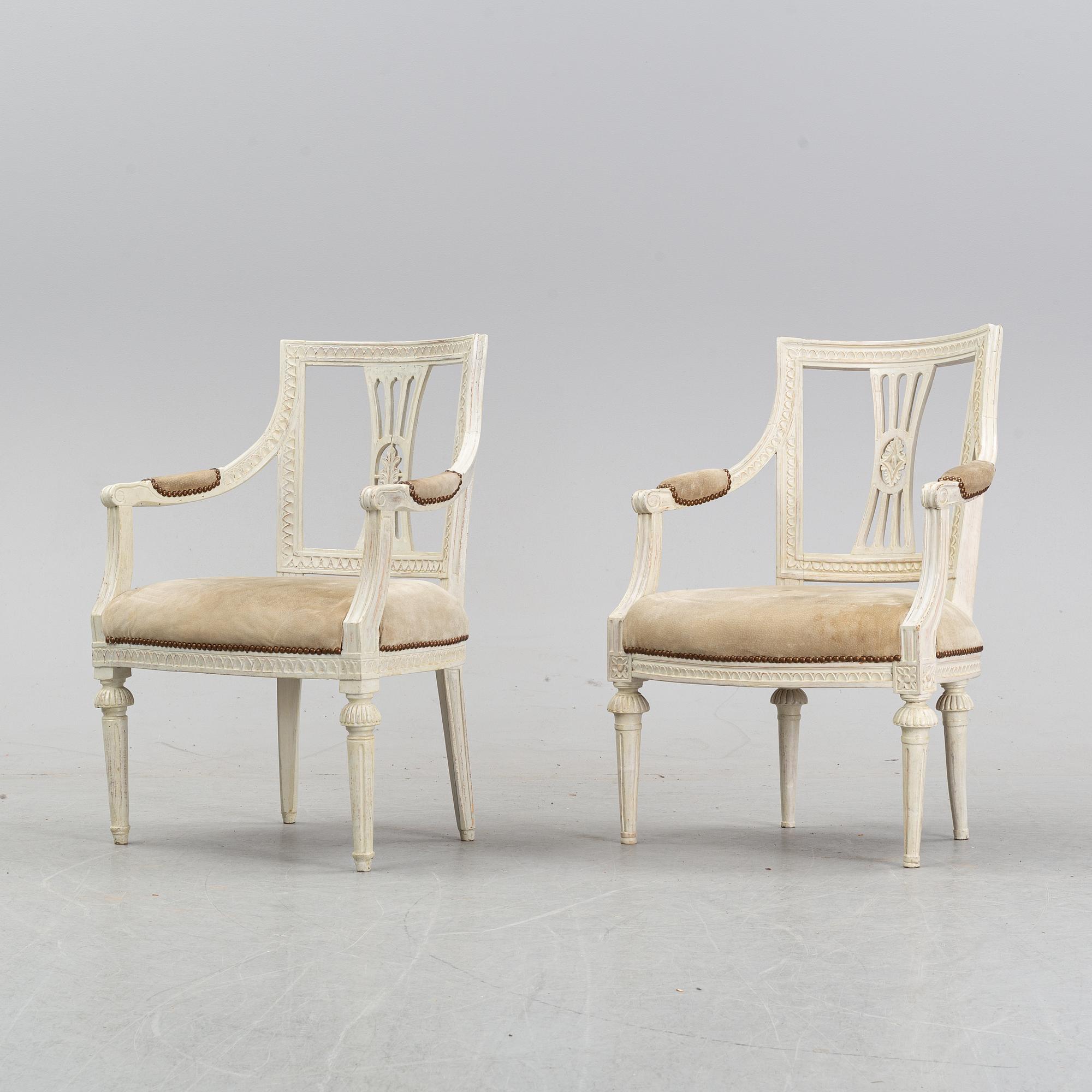 A set of two Gustavian arm chairs from the early 19th Century.