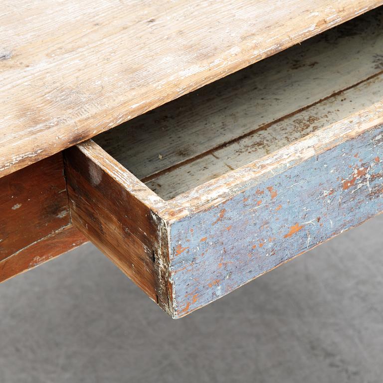A 19/20th Century table with a drawer.