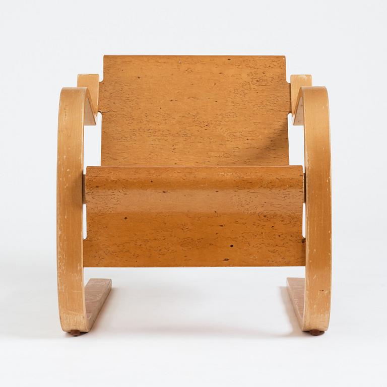 Alvar Aalto, a model 31 burled birch armchair, produced by O.y Huonekalu-ja Rakennustyötehdas, Finland or Aalto Design Hedemora.