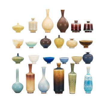 727. A Berndt Friberg set of 24 miniature stoneware vases and bowls in a teak casket, Gustavsberg Studio.