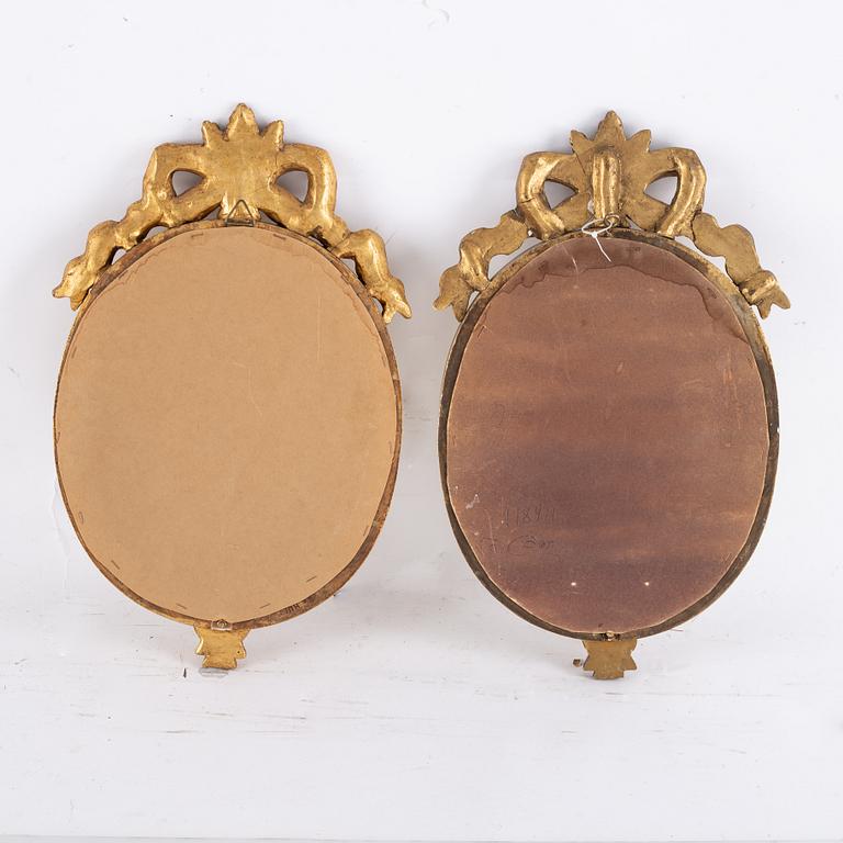 A pair of gilt Gustavian style mirror wall sconces, Stockholm, mid 20th Century.