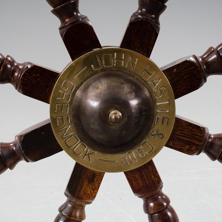 A ship steering wheel by John Hastle& Co Greenock, England, early 20th century.