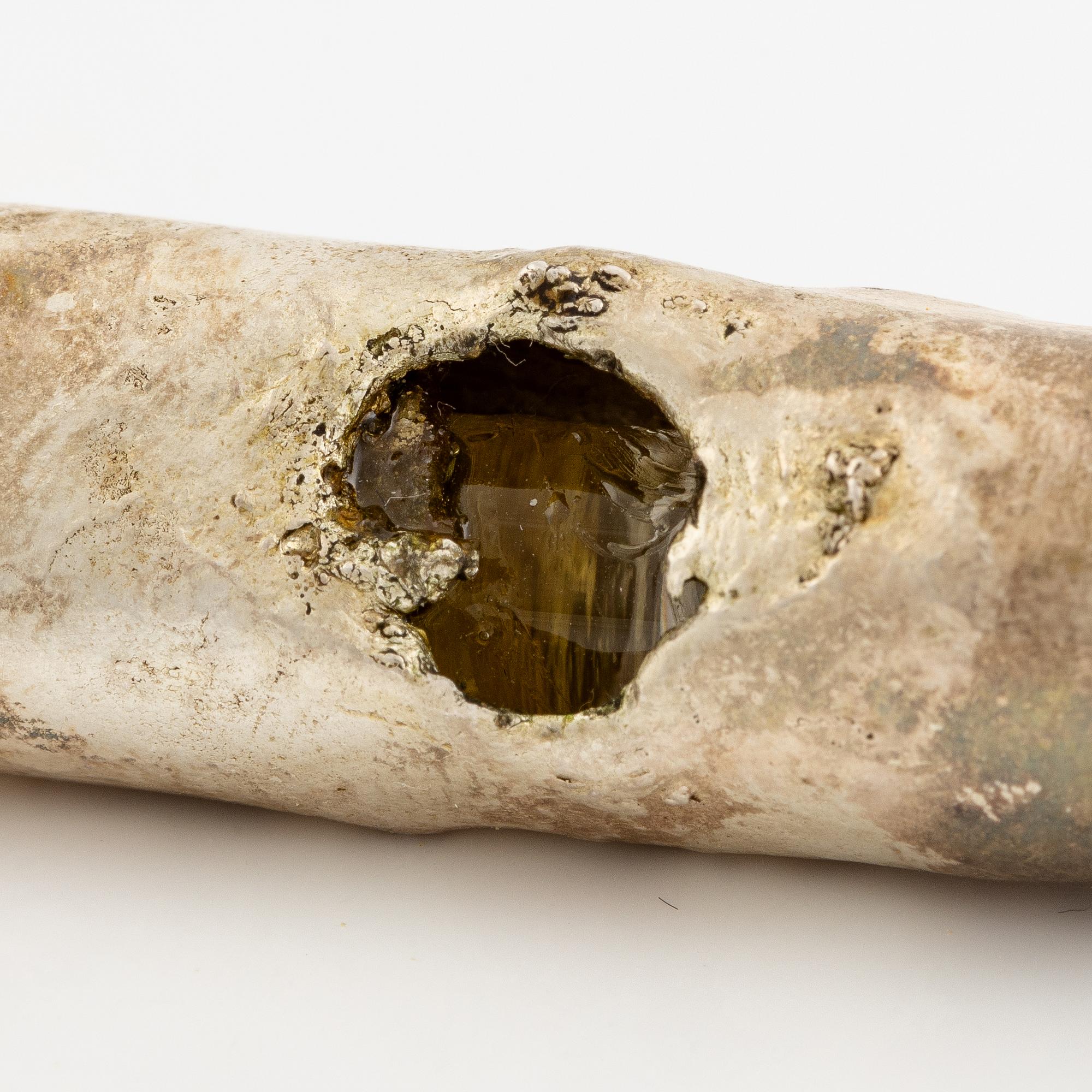 Earrings, possibly Slim Barrett.