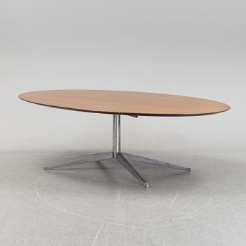 An 'Oval 96' table by Florence Knoll for Knoll International.