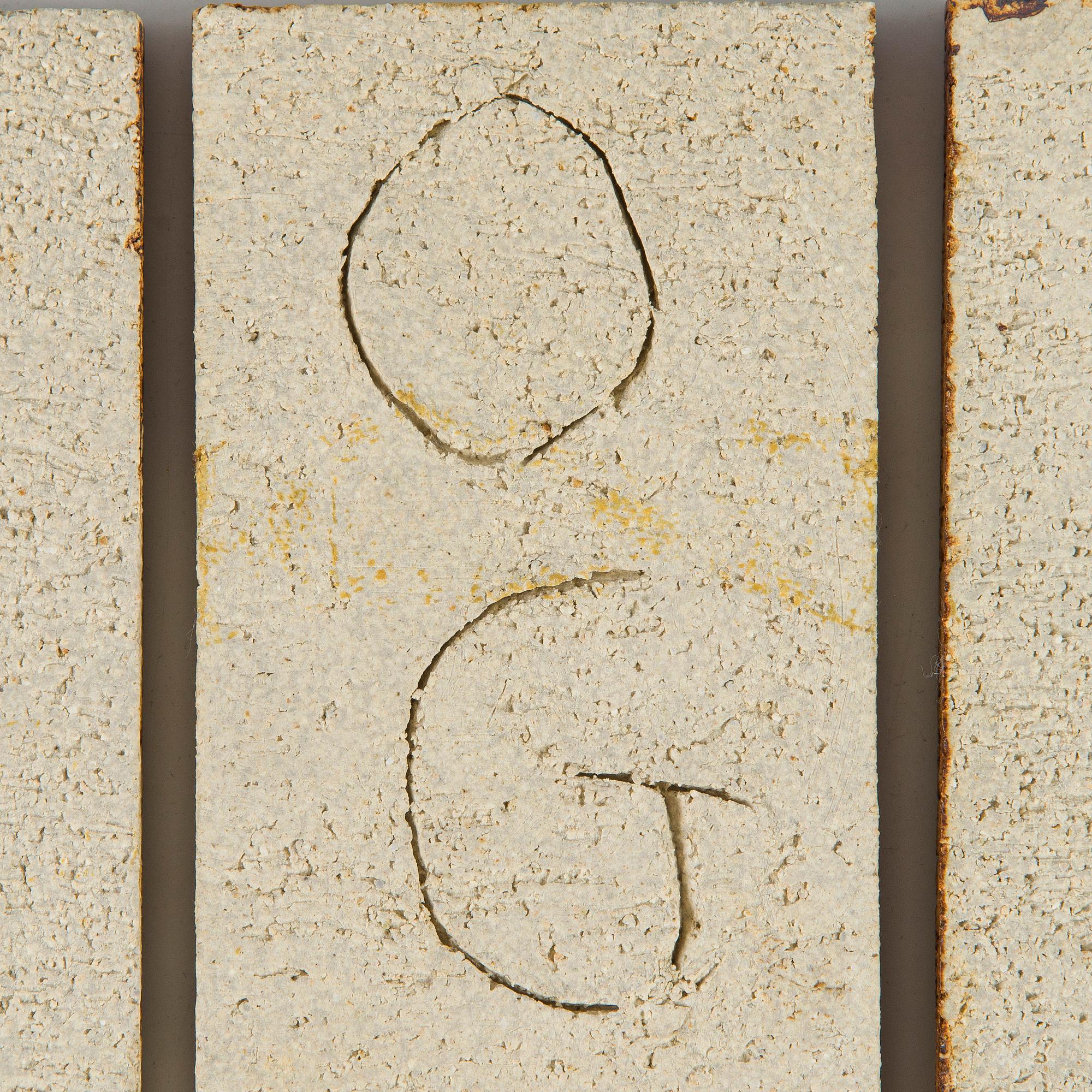 Roger Capron, a five-piece ceramic relief, signed.