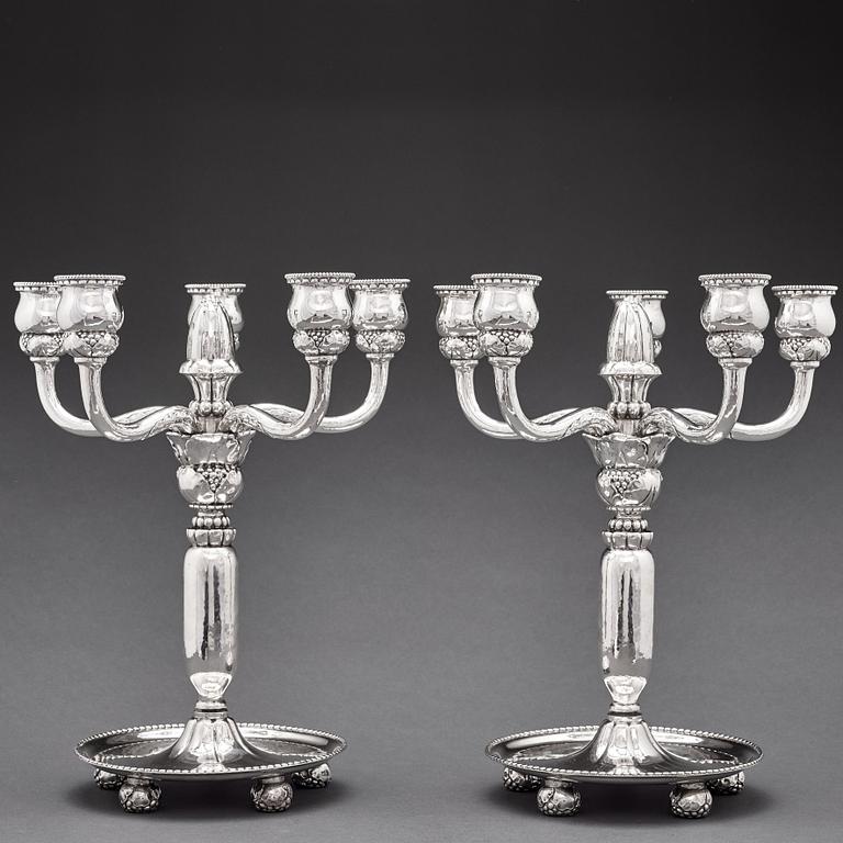 Georg Jensen, a pair of 830/1000 silver five light candelabra, Copenhagen 1920, design nr 200.