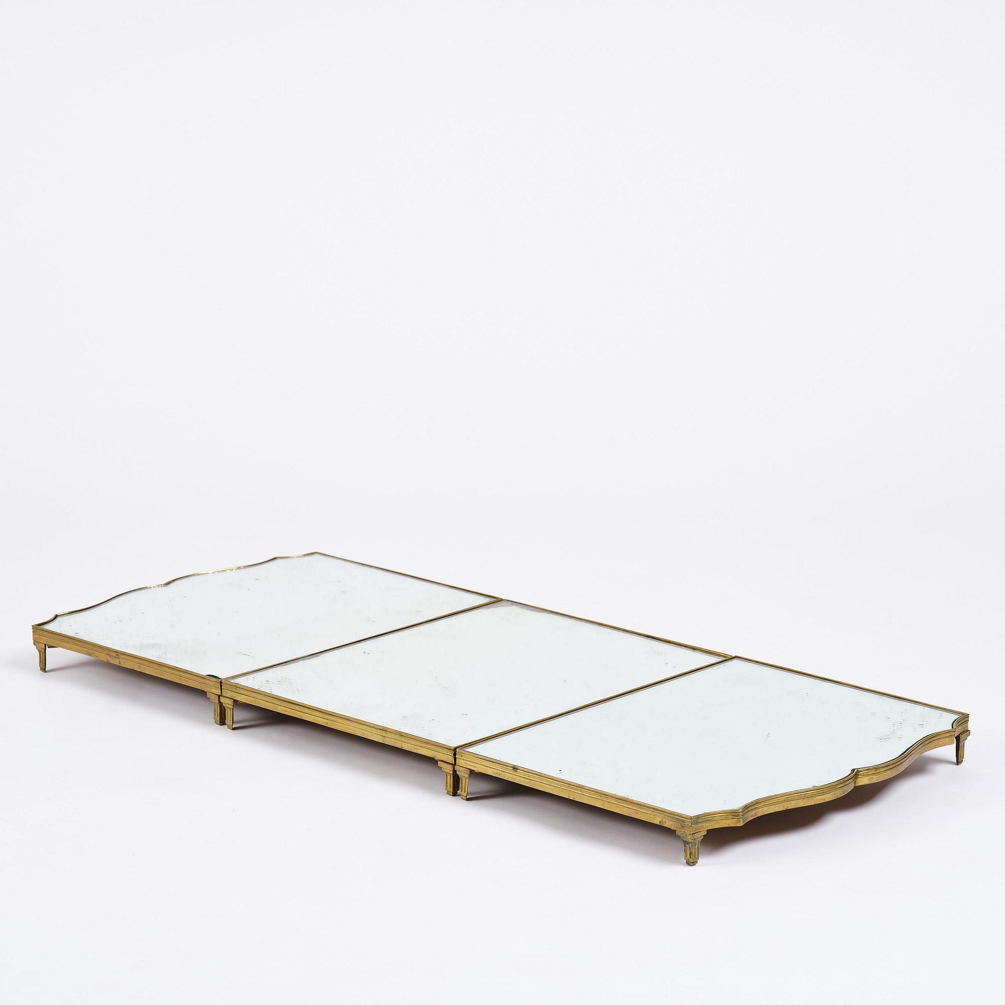 A Gustavian three-piece brass and glass surtout de table, Stockholm, later part 18th century.