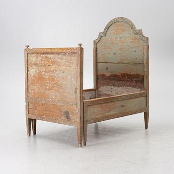 A Gustavian carved bedframe, late 18th century.