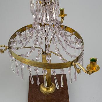 A pair of late Gustavian style three-light candelabra.