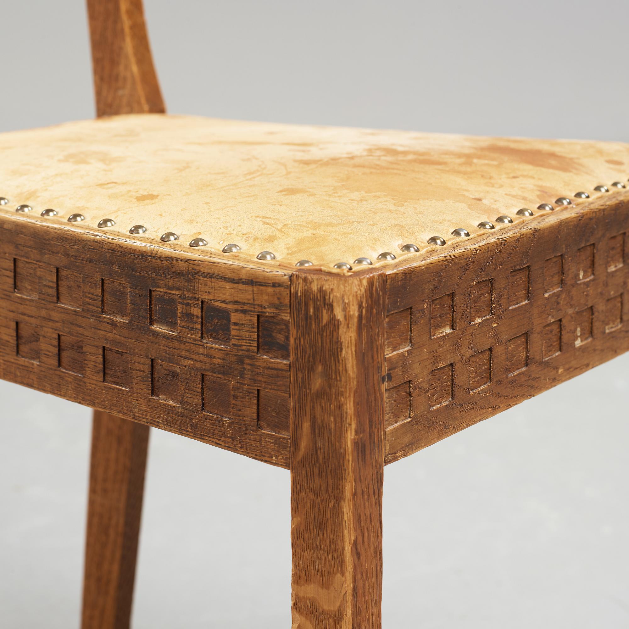 A Art Nouveau oak set with dining table, seven chairs and a side table, Finland, early 1900's.