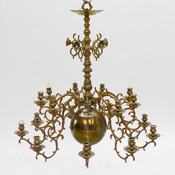 A baroque-style brass eighteen-branch chandelier, late 19th century.