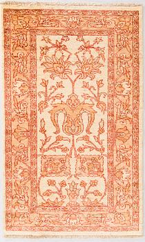 A oriental carpet. Circa 124x76 cm.