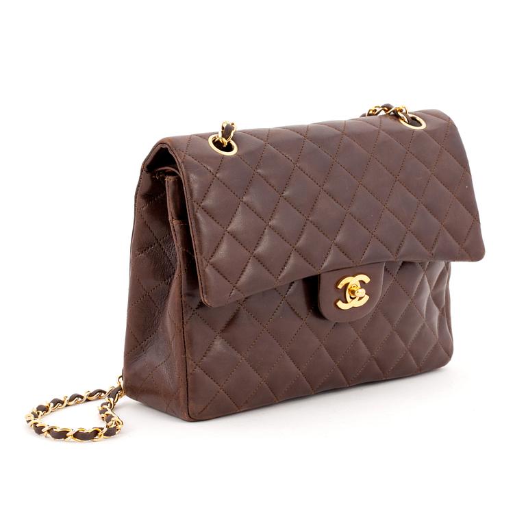 CHANEL, a quilted brown leather purse, "Flap Bag".