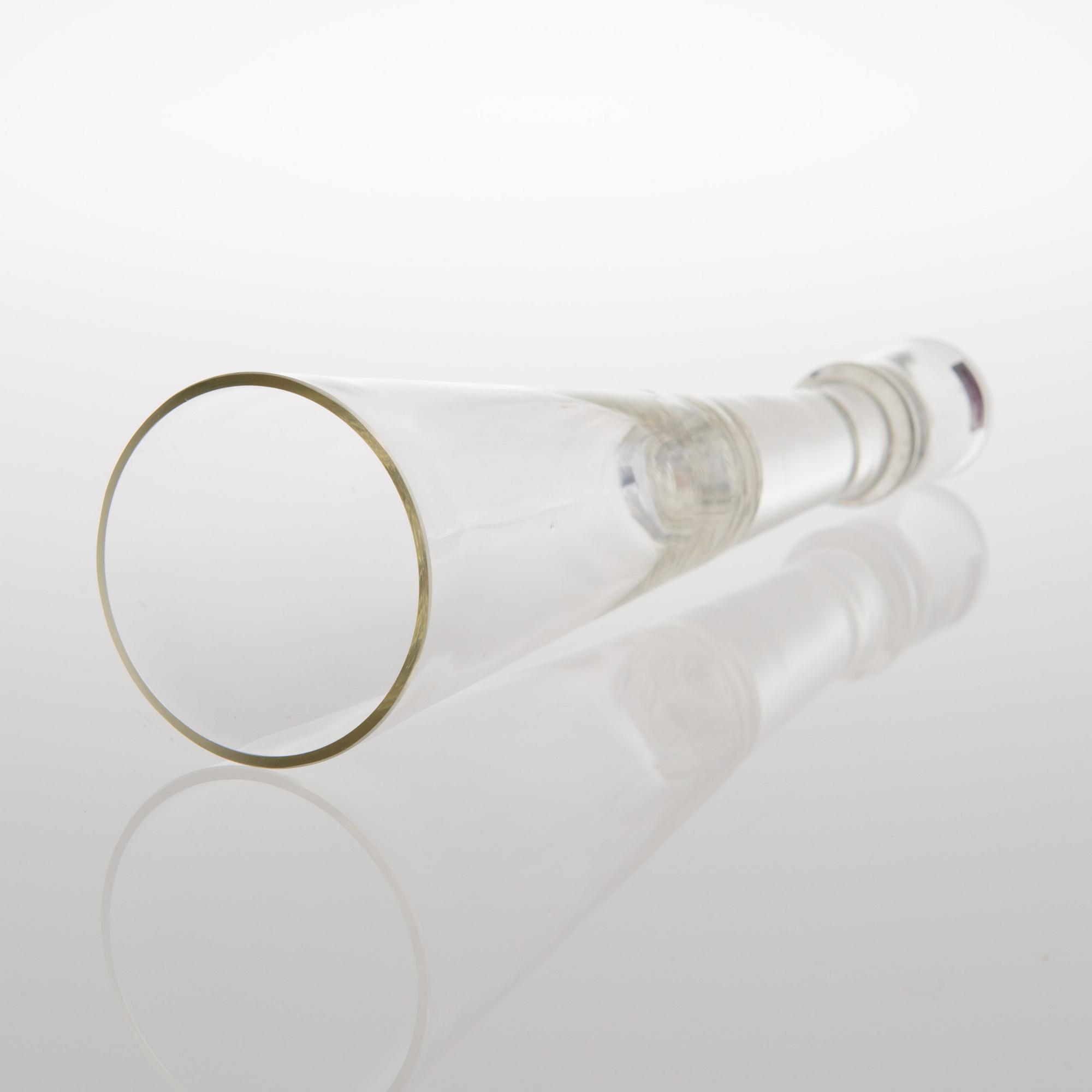 A GLASS CANDLESTICK, label marked Nuutajärvi Notsjö Boutique.