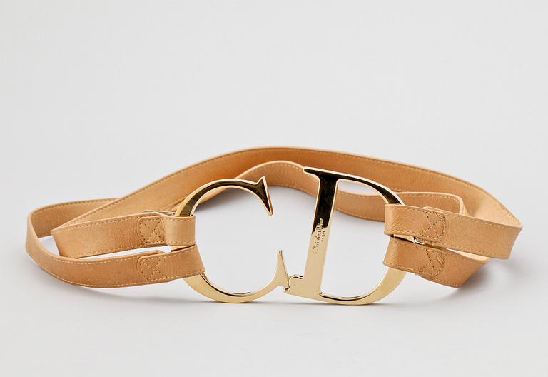 A beige leather belt by Christian Dior.