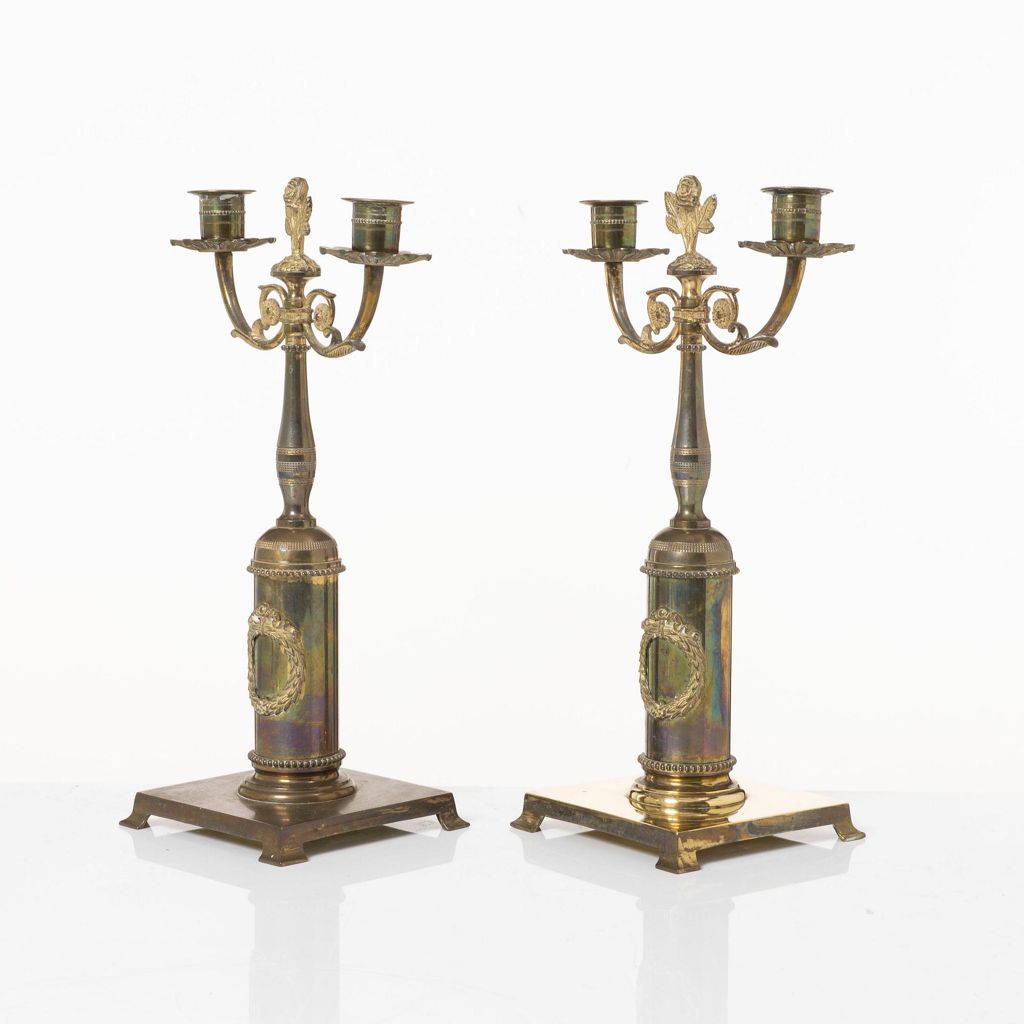 Candle holders, a pair of brass, Empire style, 20th century.