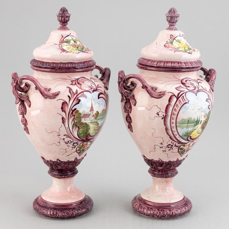 A pair of earthenware vases with covers, early 20th century.