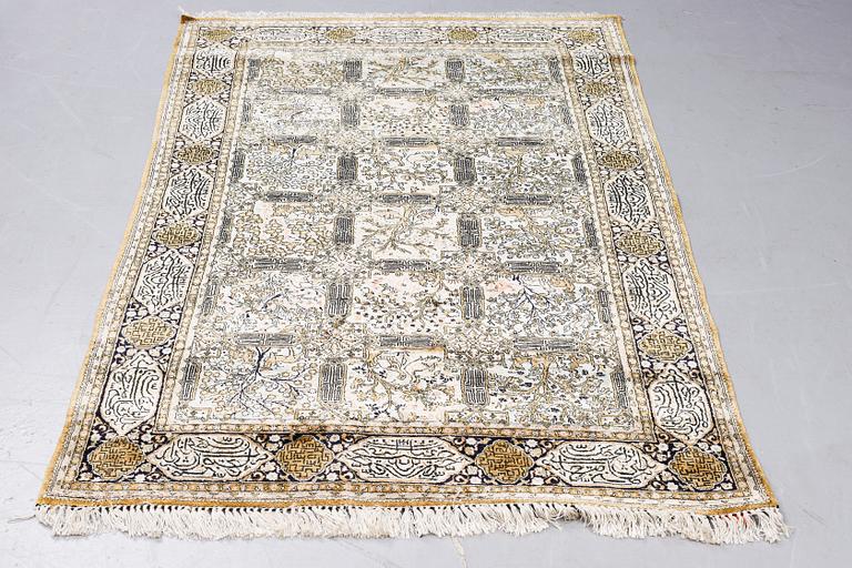 A rug, Old silk Qum, figural,  ca 214 x 142 cm.