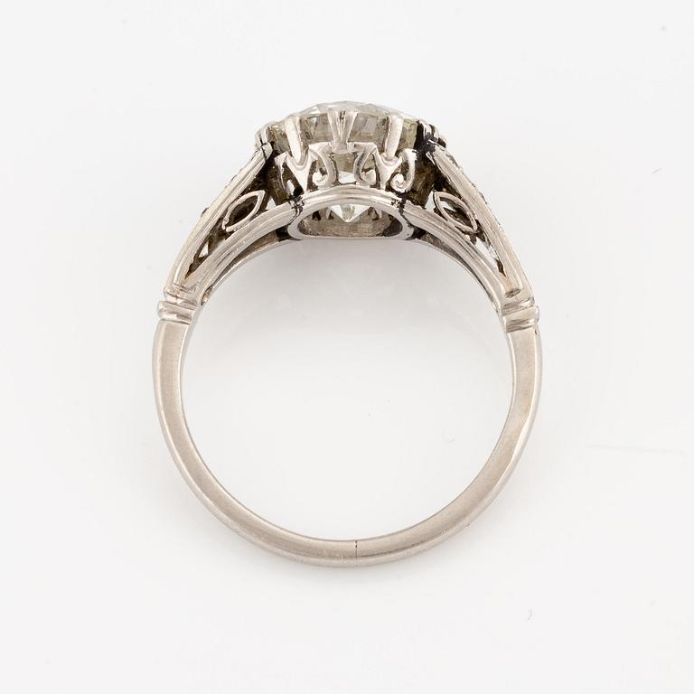 A platinum ring set with an old-cut diamond.