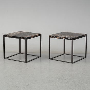 A pair of marble coffee tables from Maxalto, Italy.