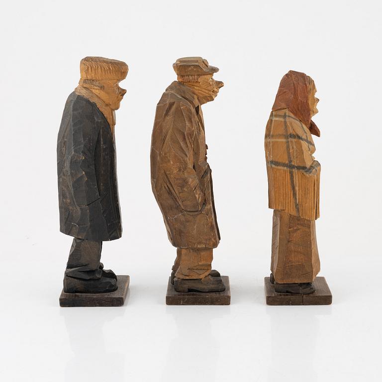 Carl Johan Trygg, three carved and painted wood figurines, signed and dated, 1920's.