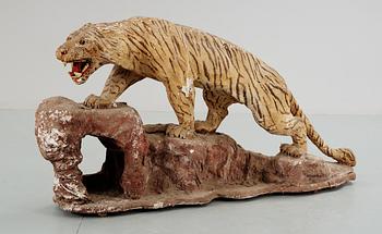 587. An early 20th cent papier-maché tiger.