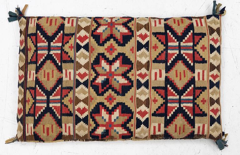 A mid-19th century carrige cushion, flat weave, c. 80 x 46 cm southwest Scania.