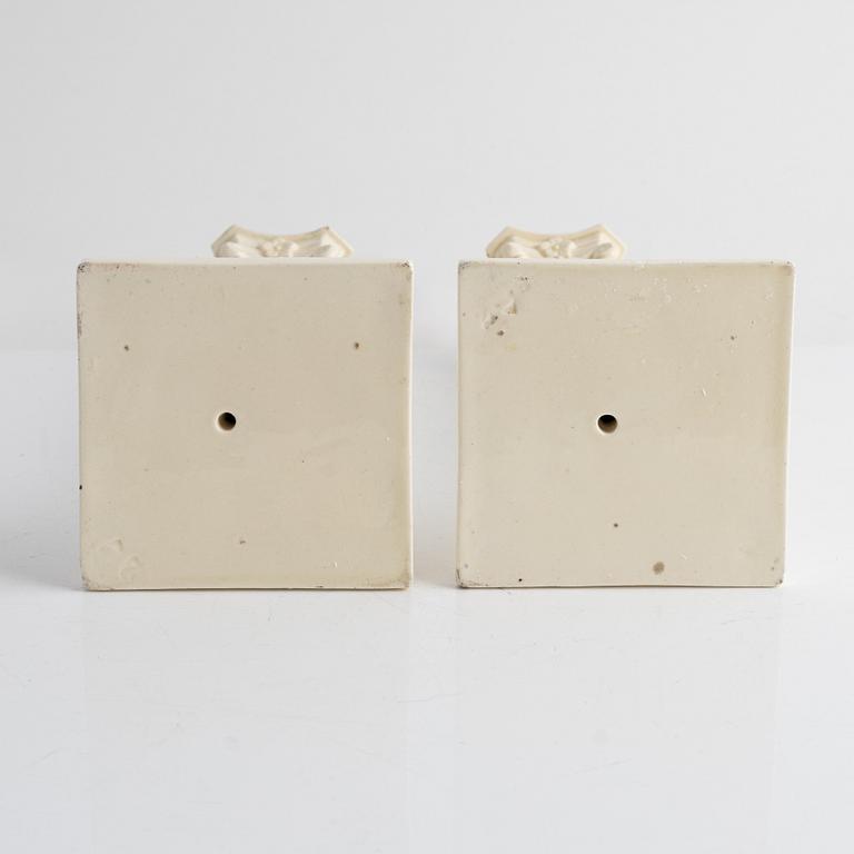 A pair of creamware candlesticks, around 1900.