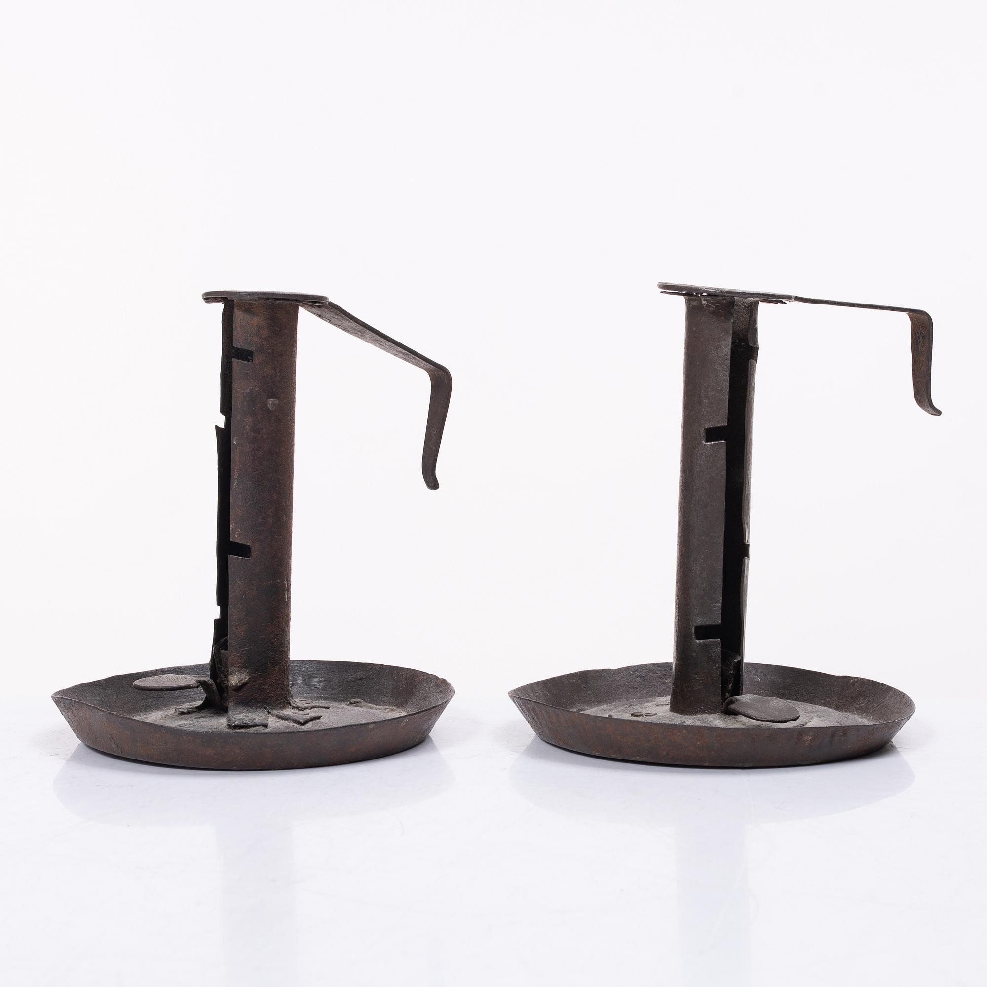 A pair of similar candle holders, 19th century.