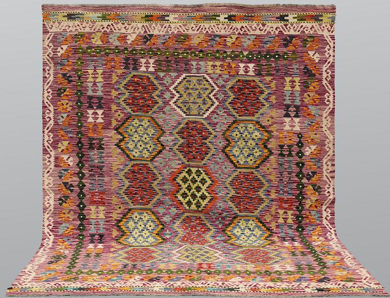 A Kilim rug, approx. 244 x 197 cm.