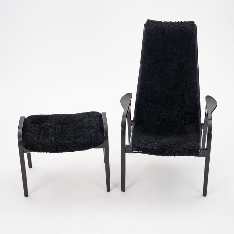 Yngve Ekström, A black "Lamino", easy chair with ottoman, Swedese, Sweden 21st Century.