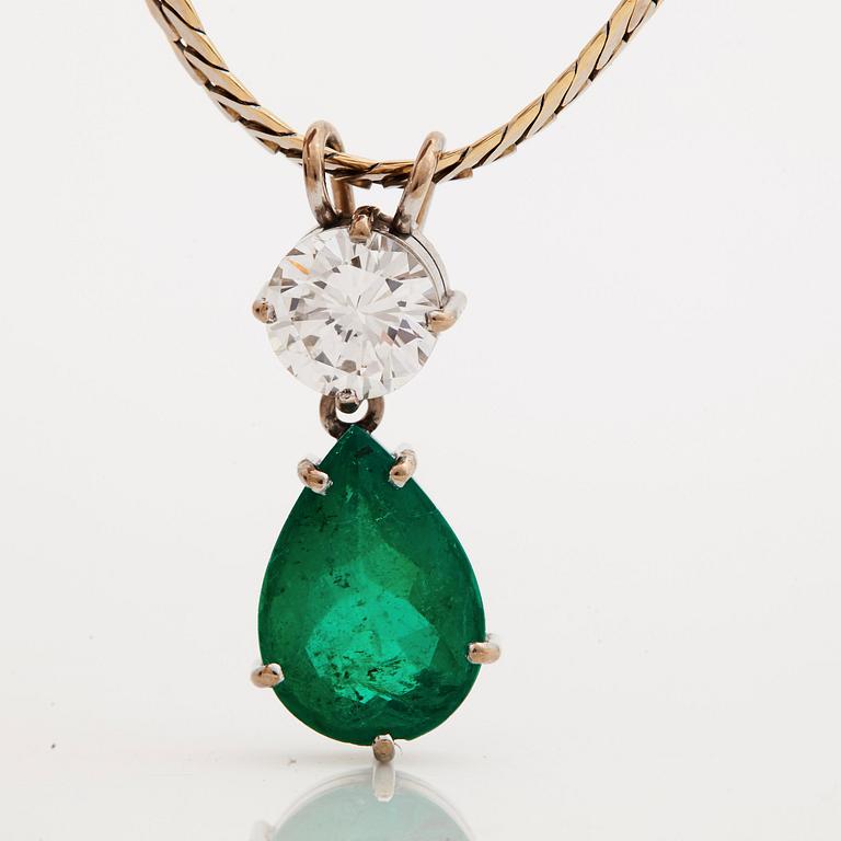 A brilliant cut diamond and a pear shaped emerald pendant.