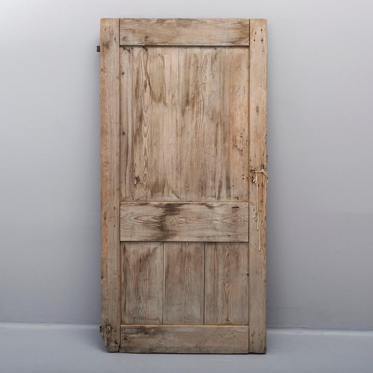 A pinted pine door, 18th /19th Century.