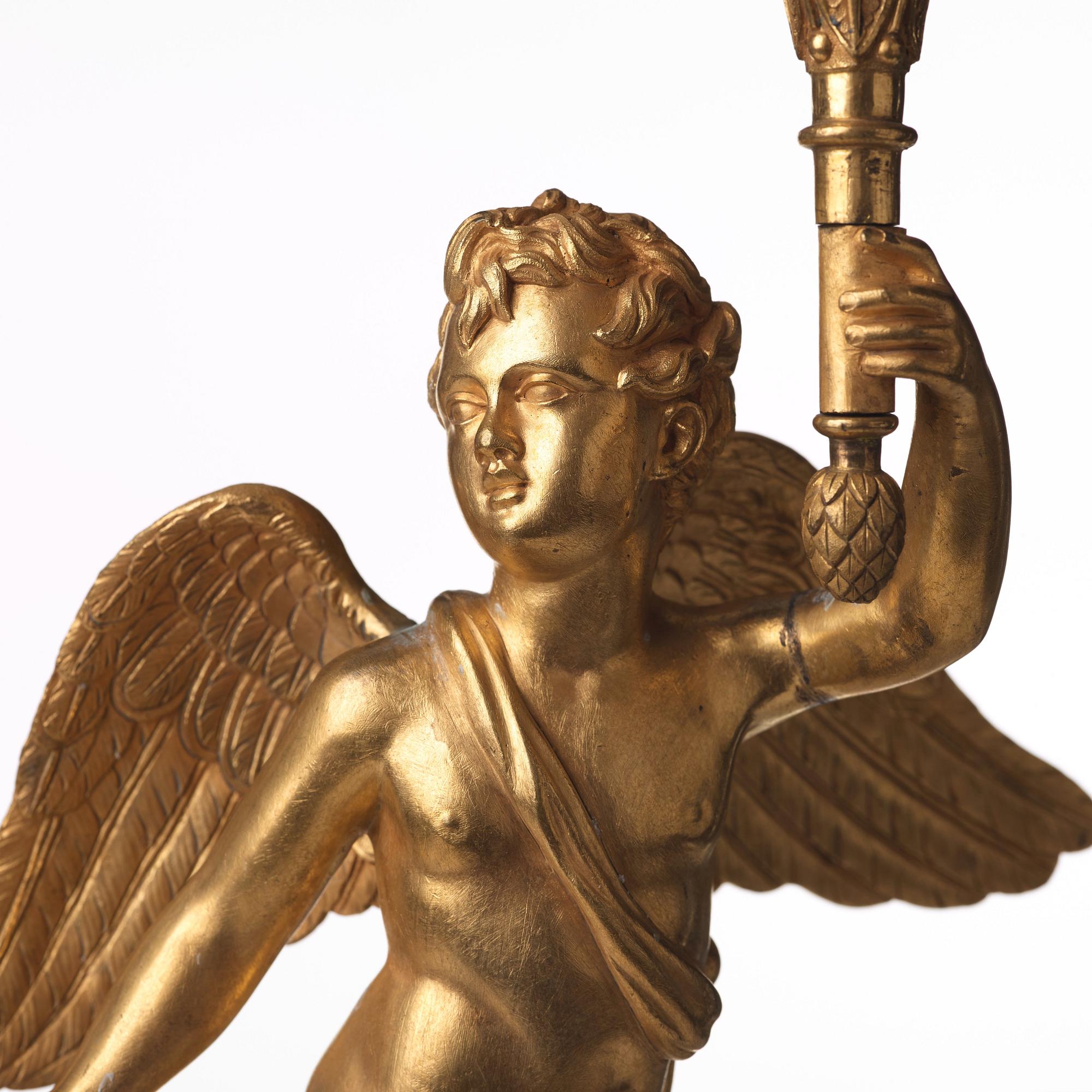 A pair of French Empire three-light candelabra, early 19th century.