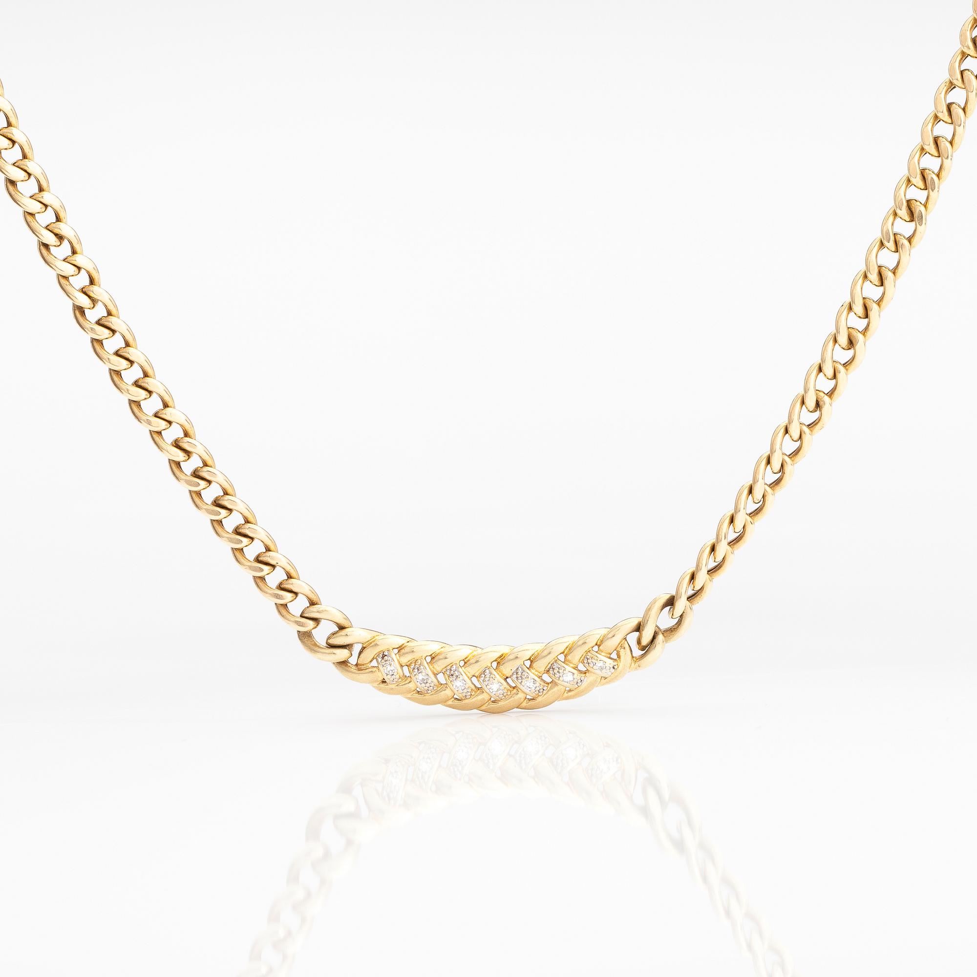 A 14K gold necklace with diamonds ca 0.035 ct in total.