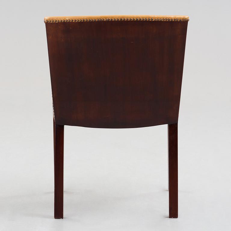 Frits Henningsen, a stained mahogany and brown leather armchair, Denmark.