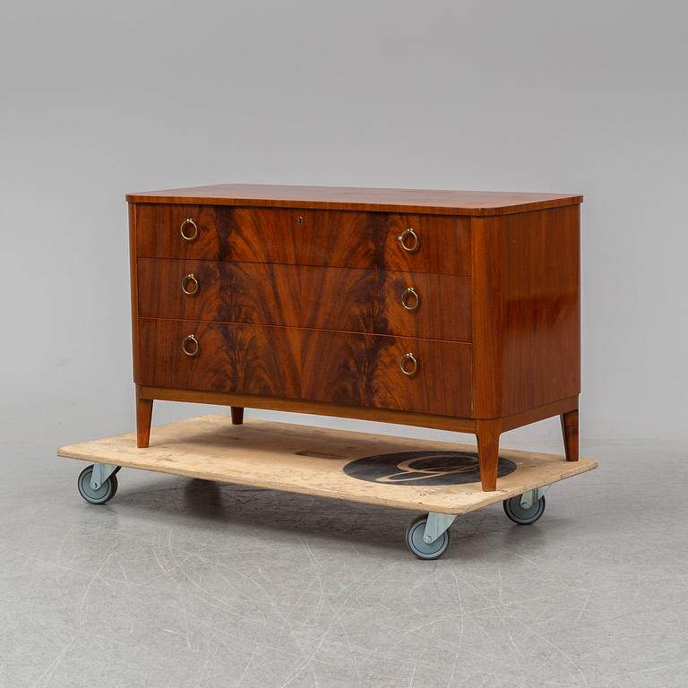 A 1940s Swedish Modern mahogany veneered chest of three drawers.