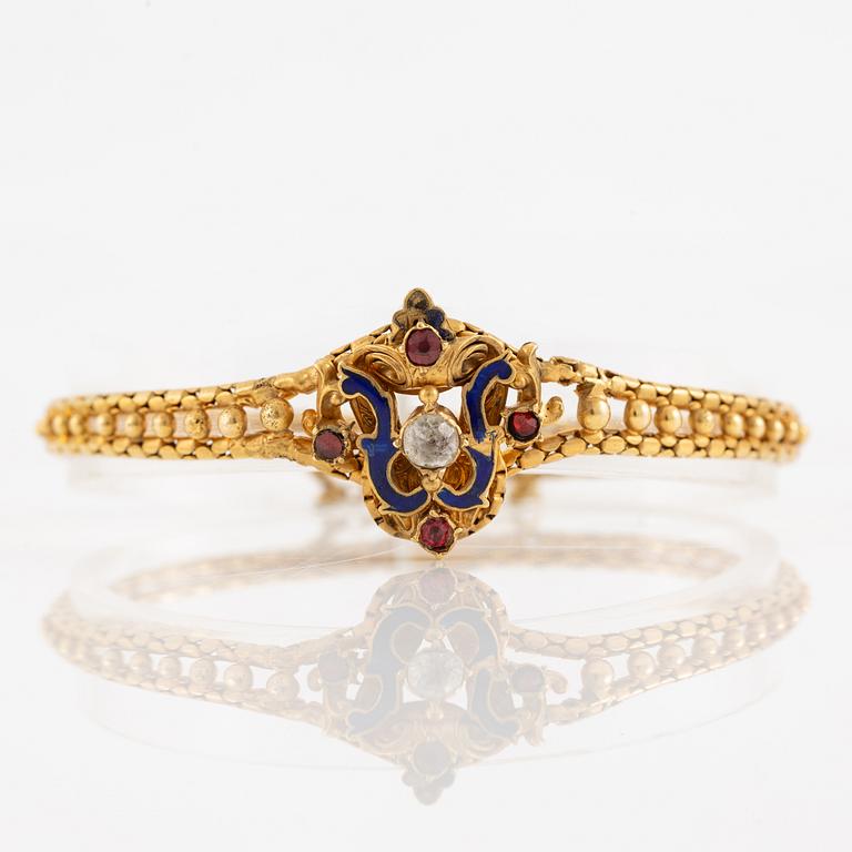 Bracelet, gilded metal with paste stones and enamel.