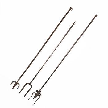 A set of three wrought iron fireplace pokers, 18th / 19th century.