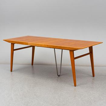 A second half of the 20th century teak and oak dining table.