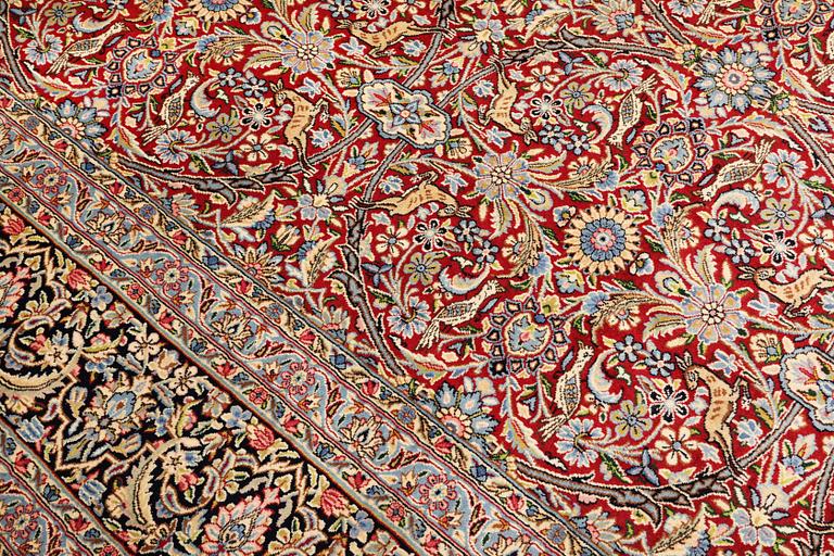 A Kirman lavar carpet, 403 x 304 cm.