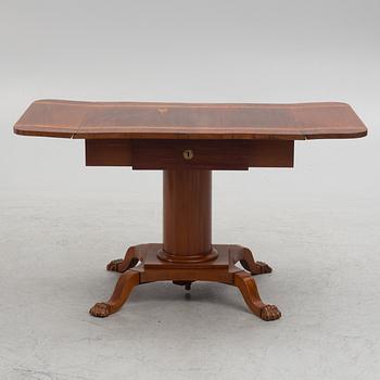 Table with folding leaves, Empire style, 19th century.